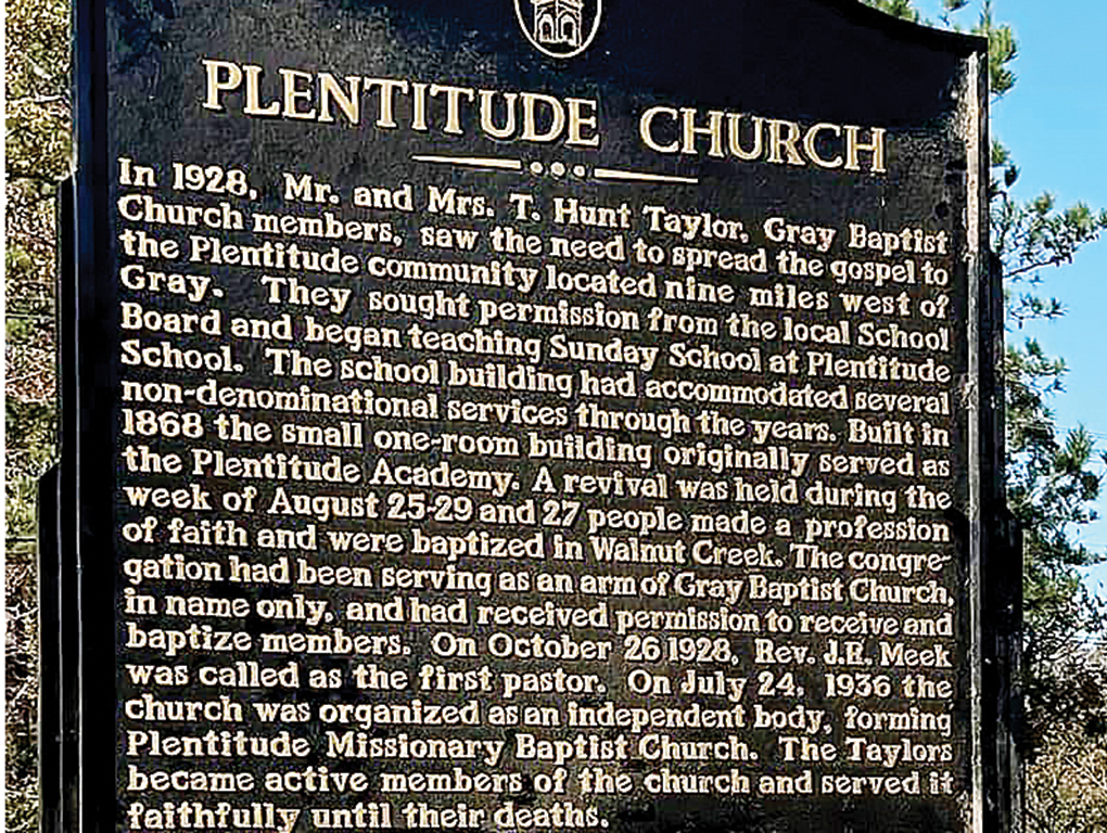 The text of the marker tells the history of the church that began in a school building in 1928. 