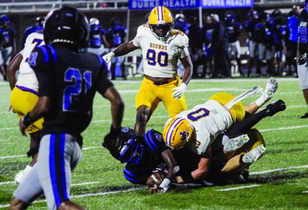 Hunter Hardwick (0) careens Burke County’s Ranquavious Morris to the ground during Friday’s shutout win. BRAD HARRISON/Staff