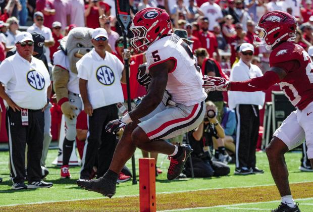 Georgia running back Chauncey Bowens (5) scampers into the end zone for a touchdown against the Arkansas Razorbacks in Fayetteville, Arkansas. UGA ATHLETICS
