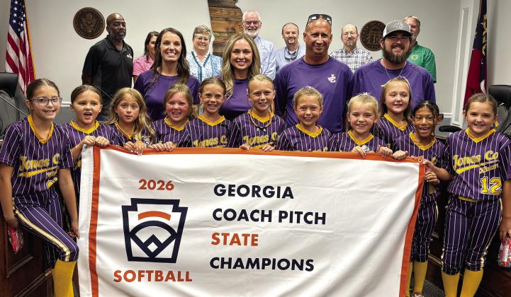 Members of the Jones County 8U Coach Pitch State Champion softball team and their coaches are celebrated by the Jones County Board of Commissioners at their July 6 meeting. DEBBIE LURIE-SMITH/Staff