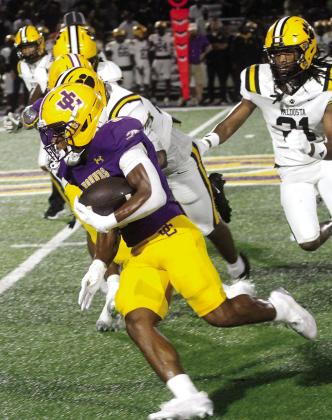 Kaden Canty rips it outside for the Greyhounds’ first touchdown of the game against Valdosta for the Greyhounds’ season opener at home. BRAD HARRISON/Staff