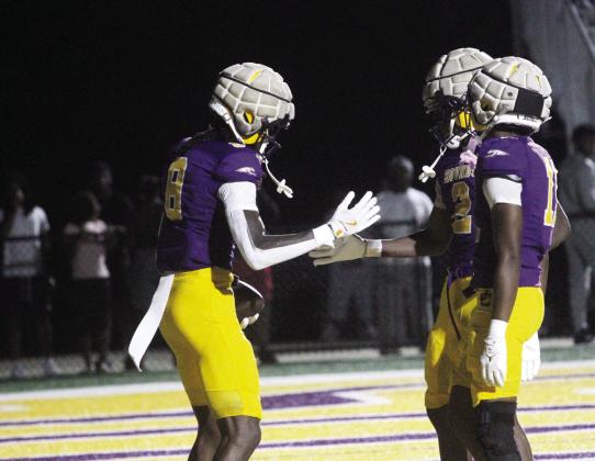 Cayden Gilmore (8) joins his teammates to celebrate a third-quarter touchdown during Friday’s preseason scrimmage win against Jasper County. SEE FULL SCRIMMAGE COVERAGE IN SPORTS >> PAGE B1 BRAD HARRISON/Staff