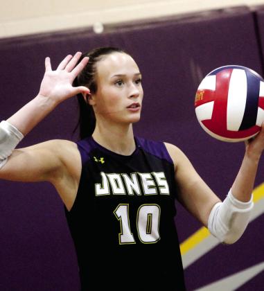 Molly Jo Register serves the ball over the net during Saturday’s state tournament match. BRAD HARRISON/Staff