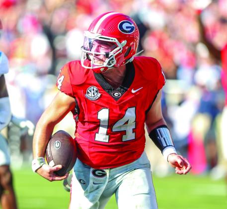 Stockton rushes past Ole Miss defenders for a touchdown last season. LANCE McCURLEY/Staff