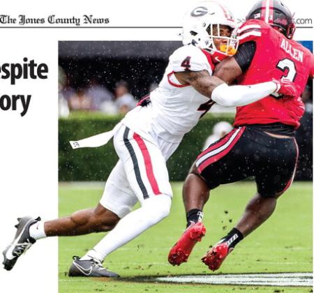 Georgia defensive back KJ Bolden takes down Western Kentucky’s Ajay Allen on the way to the Bulldogs’ 70-20 win. SKYLA MORRIS/Staff