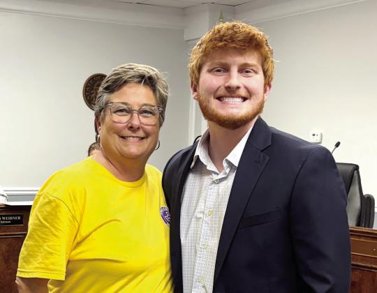 Jones County Commissioner Wendy Vaughn and Griffin Moore after he was recognized for his St. Nick’s Necessities program. DEBBIE LURIE-SMITH/Staff