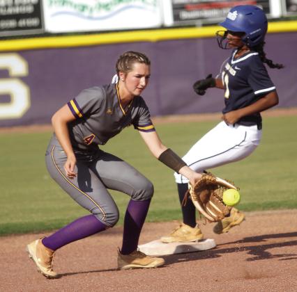 Raylee Harris snags the throw from the middle of the infield in last week’s 19-1 win. BRAD HARRISON/Staff
