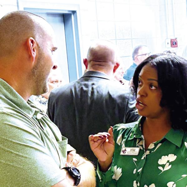 JCHS head football coach Justin Montgomery talks with CTAE Director LaMisha Clark during the Oct. 19 reception. BRAD HARRISON/Staff