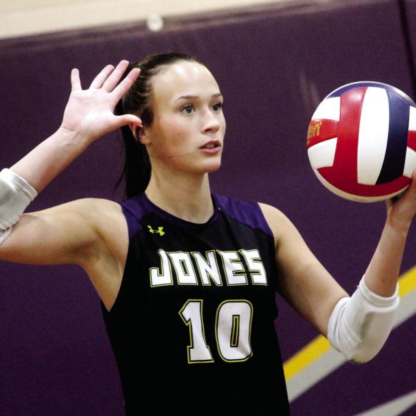 Molly Jo Register serves the ball over the net during Saturday’s state tournament match. BRAD HARRISON/Staff