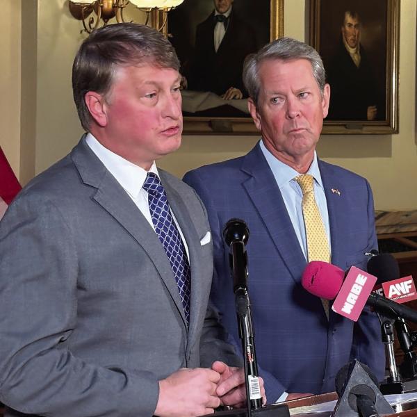 Gov. Brian Kemp at the Capitol with Pat Wilson, commissioner of the Georgia Department of Economic Development, as Wilson answers questions. TY TAGAMI/Capitol Beat