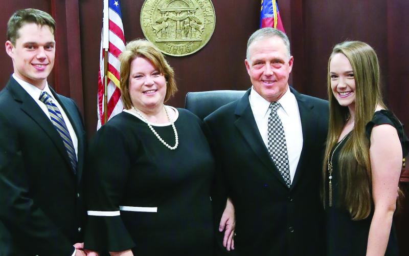 Judge Rutherford at her 2020 swearing-in with husband Boyce (second from right) and children Luke and Lauren CONTRIBUTED