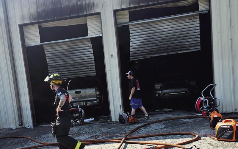 The July 6, 2025, fire destroyed the shop interior and the vehicles inside. FILE PHOTO