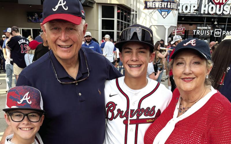 Al and Nancy Andrews at a Braves game recently with grandsons Cooper (left) and Rowdy. CONTRIBUTED