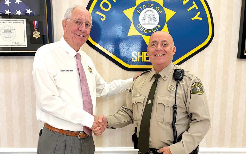 Sheriff Butch Reece congratulates Capt. Ed Bailey following his recent promotion. CONTRIBUTED