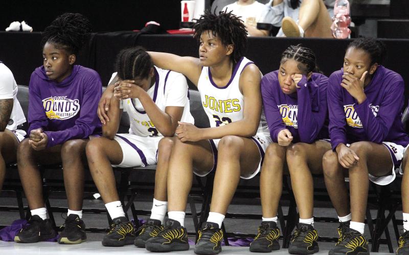 The Lady Geyhounds console one another as time runs off the clock at the end of Saturday’s state semifinal loss against Kell. BRAD HARRISON/Staff