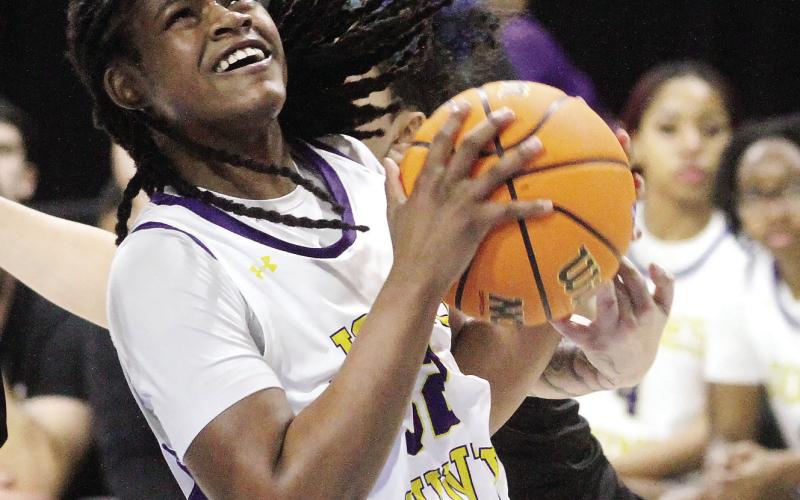 Liberty Pennamon fights toward the basket against the Longhorns. BRAD HARRISON/ Staff