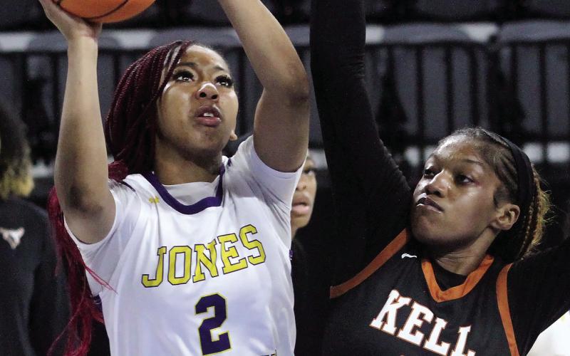 Desirae Dumas works the ball inside against the Longhorns. BRAD HARRISON/Staff