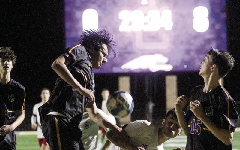 The Greyhounds’ back line converges to turn away a second-half scoring try by GMC Prep. BRAD HARRISON/Staff