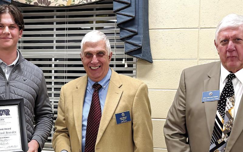 Cash Bearden receives the Star Student award from Kiwanis President Joe Briley (center) and Kiwanis member William Mathews. DEBBIE LURIE-SMITH/Staff