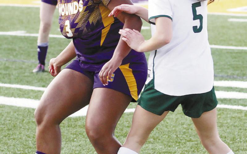 Mikayla Mallory fights to win a ball against Eastside. BRAD HARRISON/Staff