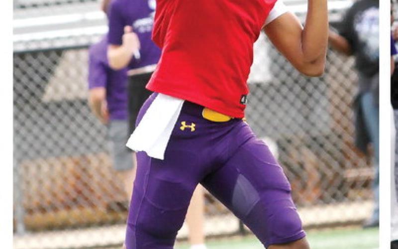 Jonathan Hurley rips a pass down field for the Purple offense during last week’s scrimmage. BRAD HARRISON/Staff