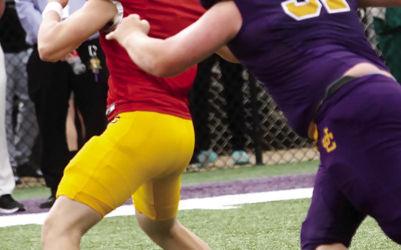 Ethan Jones beats the pass rush to get off a throw. BRAD HARRISON/Staff