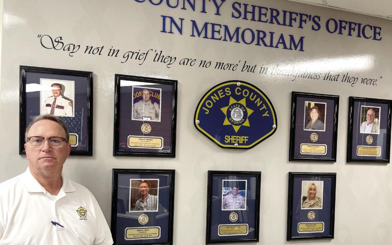 Humphries at the ‘In Memoriam’ Wall at the Jones County Sheriff’s Office. CONTRIBUTED