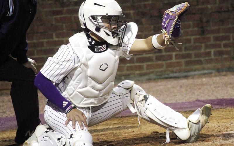 MJ Lane sets up the target behind the plate in the second inning of Tuesday’s game. BRAD HARRISON/Staff