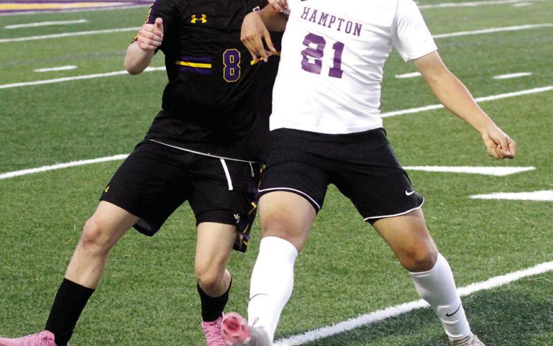 Jackson Durden fights for possession of the ball against Hampton. BRAD HARRISON/Staff