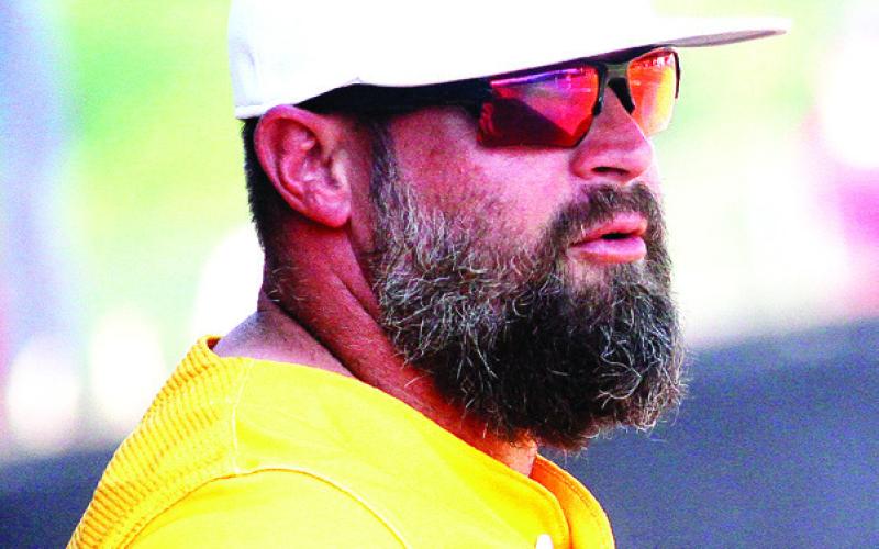 Greyhounds head coach Noble Coley directs instructions from the dugout against Glynn Academy. BRAD HARRISON/Staff