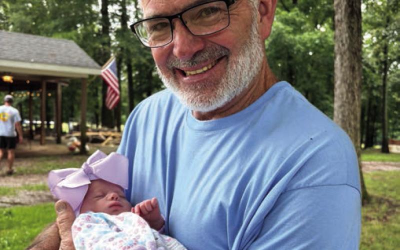 Chris with granddaughter born two weeks ago: “Heaven on Earth.” CONTRIBUTED