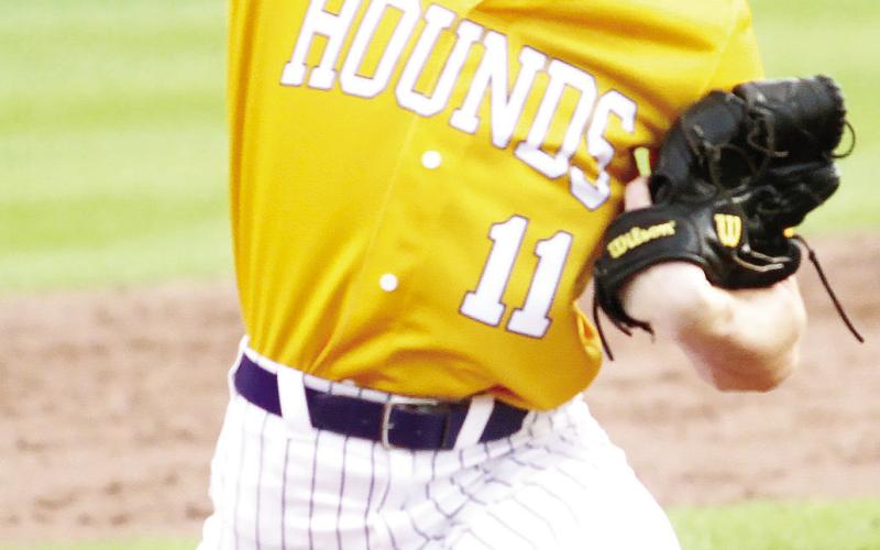Dalton Lowe delivers a pitch last Wednesday against Locust Grove. BRAD HARRISON/Staff