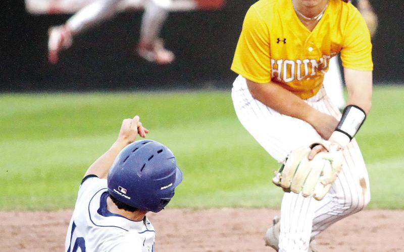 Trent Paulk sidesteps a Wildcats runner to make the out at second base. BRAD HARRISON/Staff