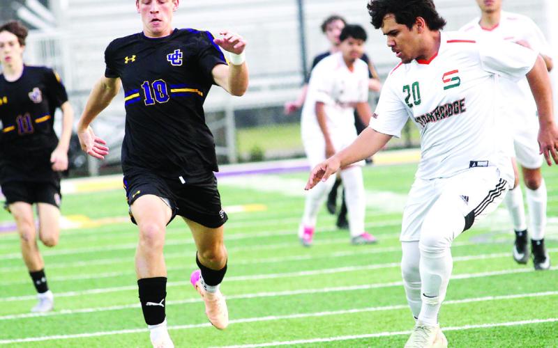 Jacob Watts dribbles the ball upfield in the first half against the Tigers. BRAD HARRISON/Staff
