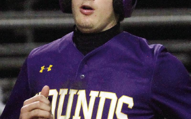 Nate Vaughn crosses home plate for a late Greyhounds run. BRAD HARRISON/Staff