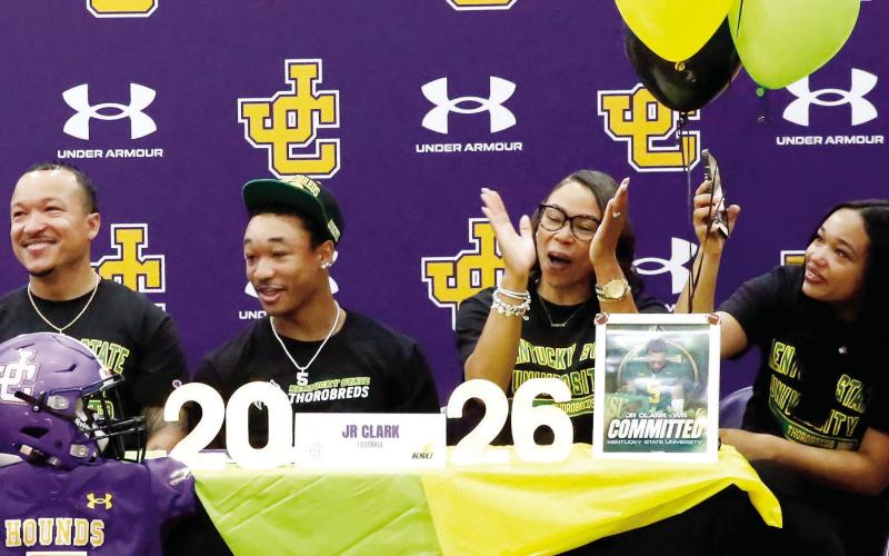 JR Clark and his family celebrate him signing with Kentucky S tate. LINDSEY THOMAS/Contributed