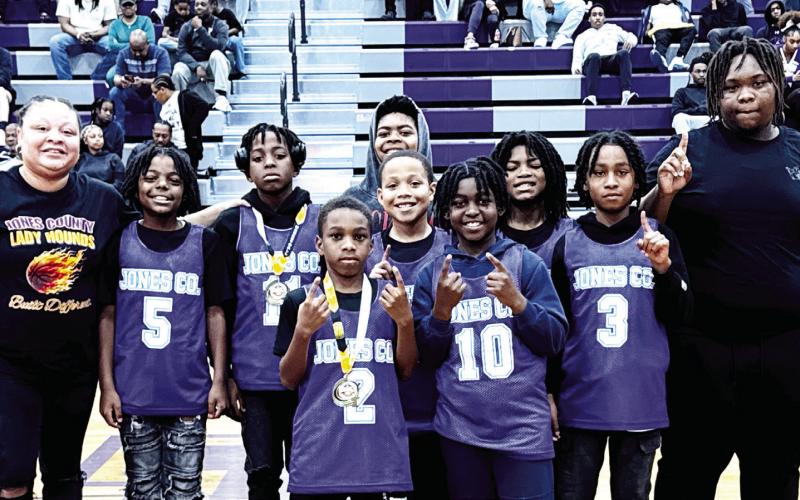 Jones County’s 10U Basketball All Stars pose as they’re recognized during Friday’s high school state tournament game at the JCHS Gymnasium. BRAD HARRISON/Staff