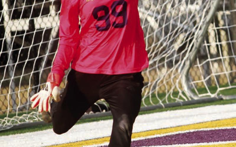 Daisy Blanton clears the ball away from the net after a second-half save against the Knights. BRAD HARRISON/Staff