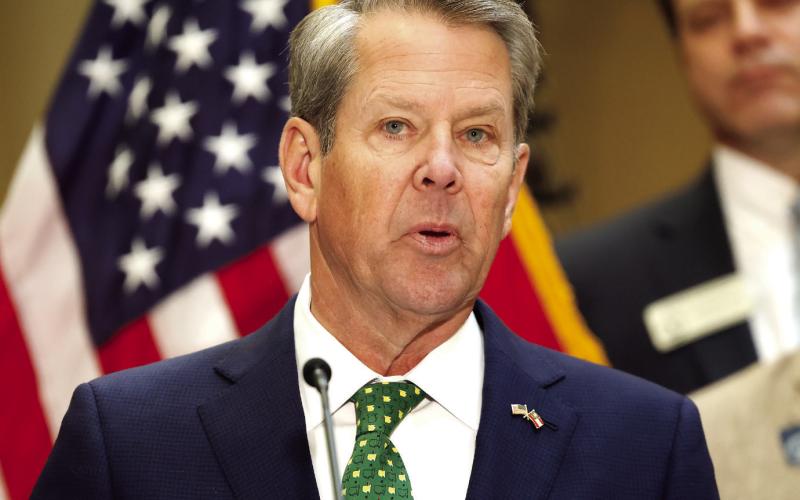 Gov. Brian Kemp speaks before signing Georgia House Bills 1199 and 1000 into law at the Georgia State Capitol on Friday, March 20, 2026. The laws suspend the state motor fuel tax for 60 days and implement one-time income tax rebates. ASHTIN BARKER/Capitol Beat