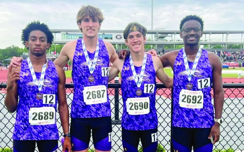 The Greyhounds’ 4x800 relay team poses after finishing third in the state on Monday. CONTRIBUTED PHOTOS