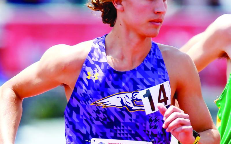 Luke Thornton ran to a podium finish in the 1600 meters during the 1,600-meter run. LANCE McCURLEY/Staff
