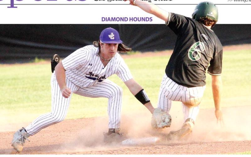 Trent Paulk reaches in to make the tag on Monday against Ola. BRAD HARRISON/Staff