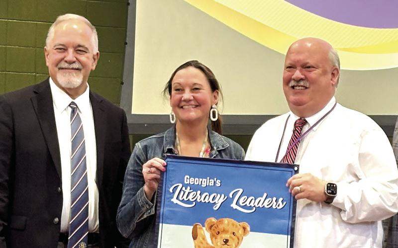 Dames Ferry Elementary Principal Wes Cavendar and Asst. Principal Kristin Jones accept their school’s award. DEBBIE LURIE-SMITH/Staff