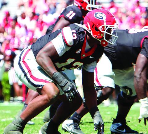 Georgia edge rusher Mykel Williams (13) lines up before a play during the annual G-Day scrimmage. LANCE McCURLEY/Staff