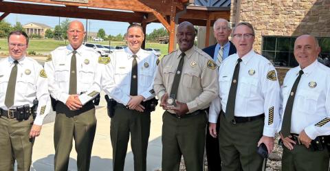 Lt. Travis Walker (fourth from left) was accompanied by Jones County Sheriff Butch Reece (back row), Capt. Kenny Gleaton, Capt. Shane Moody, Chief Deputy Earl Humphries and Capt. Ed Bailey at the July 1 ceremony. CONTRIBUTED