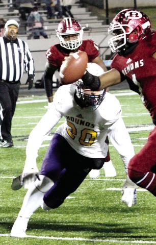 Kaleb Wiggins closes in to slow down Warner Robins quarterback Jalen Addie during the Greyhounds’ semifinal loss to end the 2020 season. BRAD HARRISON/Staff