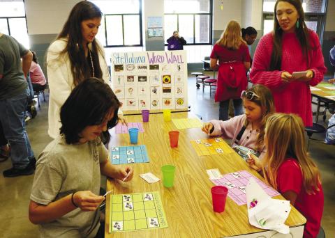Students at Wells Elementary School engage in a Stellaluna Word Wall activity during literacy night. NATHAN CLARKE/Contributed