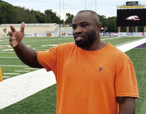 Torrez Finney, fresh off winning a UFC contract, reminisces with a camera crew about his time as a football player at JCHS. BRAD HARRISON/Staff