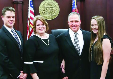 Judge Rutherford at her 2020 swearing-in with husband Boyce (second from right) and children Luke and Lauren CONTRIBUTED