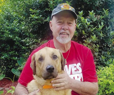 Rick Tipton and his dog Zeke, who was saved from Tipton’s home in the midst of a blaze. CONTRIBUTED